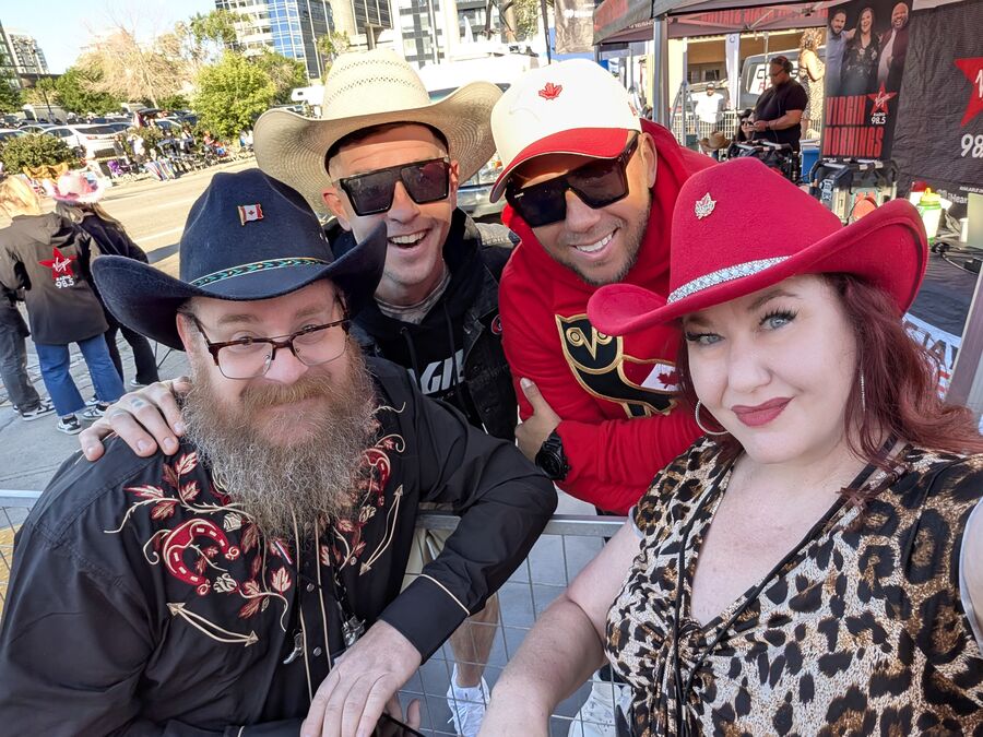 Cast and crew in red cowboy hats