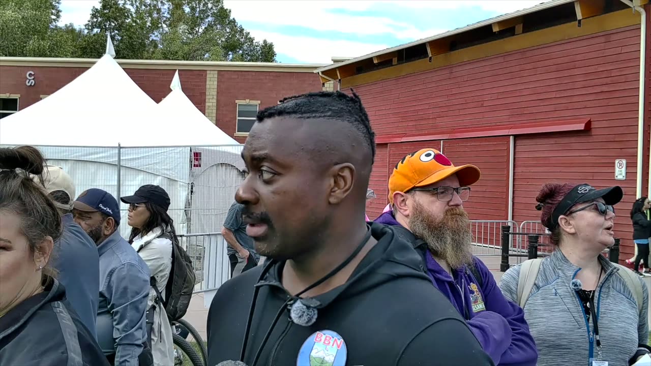 Cheyenne Sharpe and Action Jackson by a festival tent