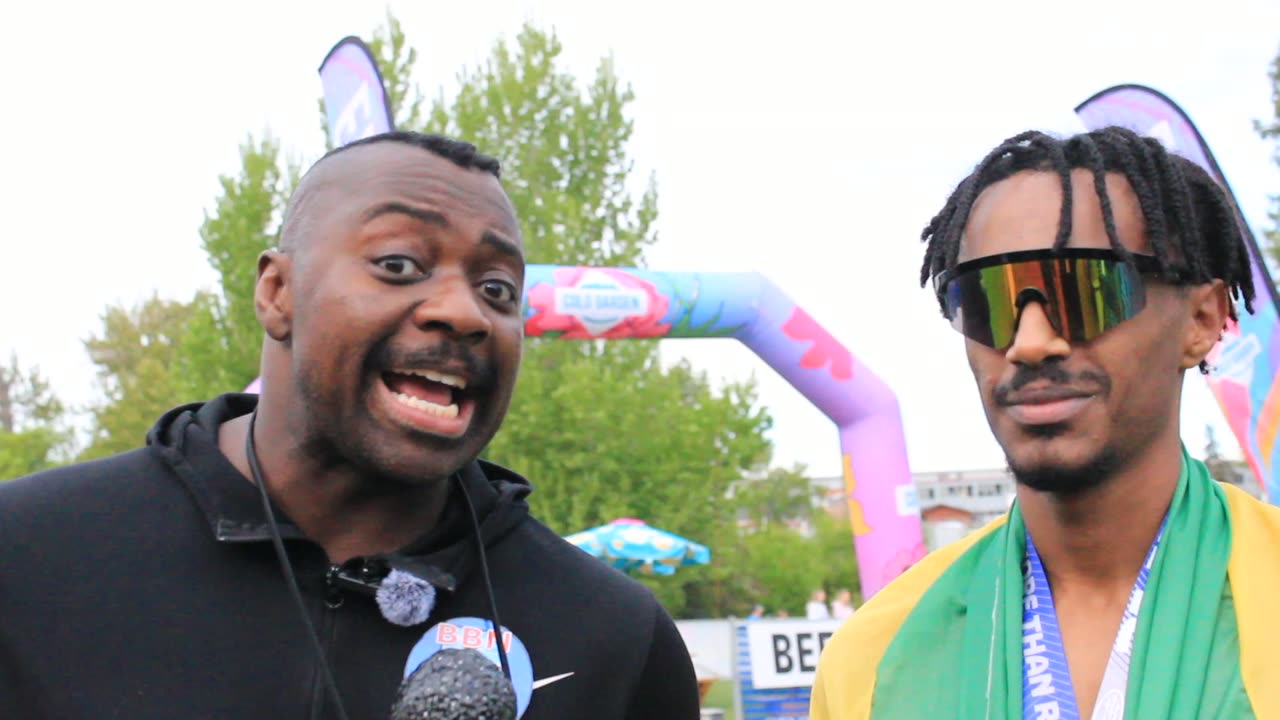 Action Jackson interviewing a runner in rainbow sunglasses