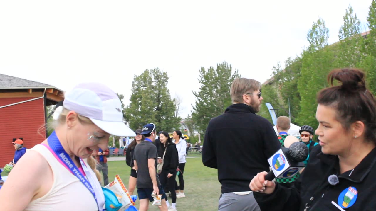 Two women being interviewed after the Calgary Marathon